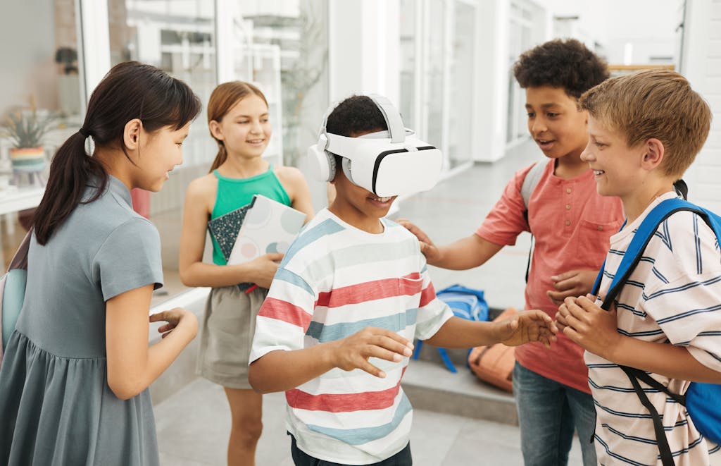 Diverse group of kids interacting with VR headset in a classroom setting.